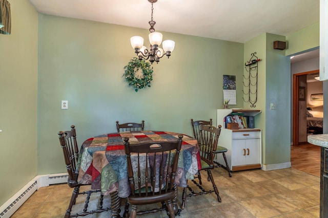 707 Marshall Ave, Henning, MN 56551 - dining space with a chandelier and a baseboard heating unit