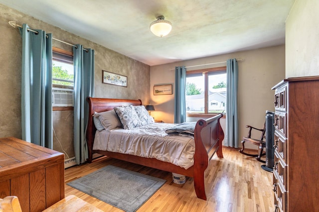 707 Marshall Ave, Henning, MN 56551 - bedroom with light wood-type flooring and cooling unit