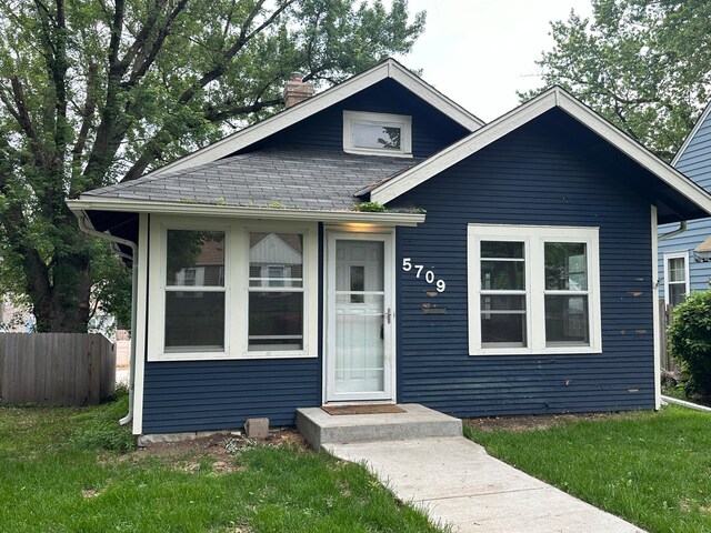 5709 26th Ave S, Minneapolis, MN 55417 - bungalow-style home with a chimney and a shingled roof