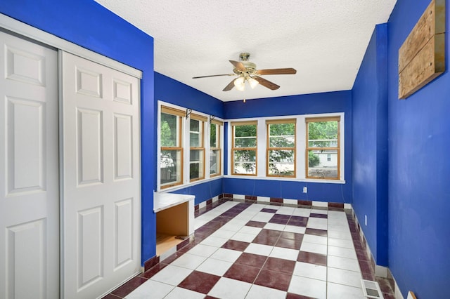 5709 26th Ave S, Minneapolis, MN 55417 - tiled foyer with a ceiling fan and a textured ceiling