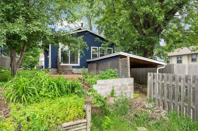 5709 26th Ave S, Minneapolis, MN 55417 - view of home's exterior with entry steps and a central AC unit