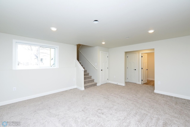 1109 University Dr S, Fargo, ND 58103 - basement with stairs, light carpet, and recessed lighting