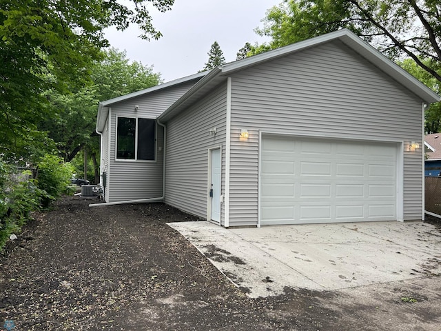 1109 University Dr S, Fargo, ND 58103 - view of side of home with driveway and a cooling unit