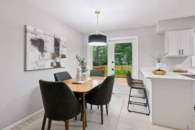 711 9th St NW, Buffalo, MN 55313 - dining room featuring french doors and light wood-type flooring