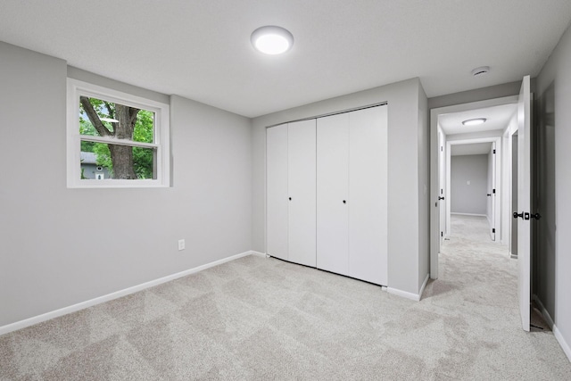 711 9th St NW, Buffalo, MN 55313 - unfurnished bedroom with light colored carpet and a closet