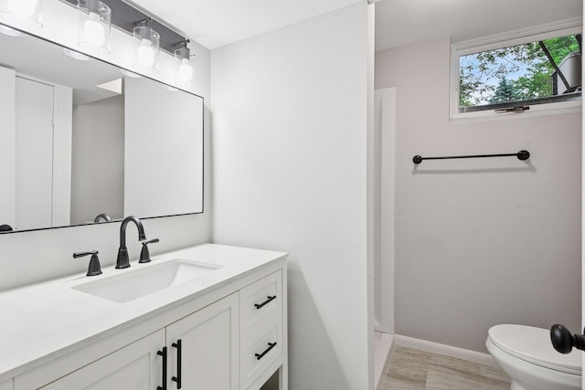 711 9th St NW, Buffalo, MN 55313 - bathroom with vanity and toilet