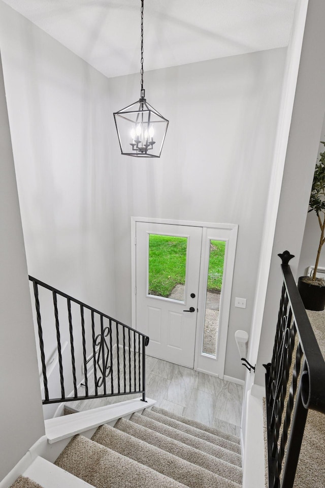 711 9th St NW, Buffalo, MN 55313 - staircase with a chandelier