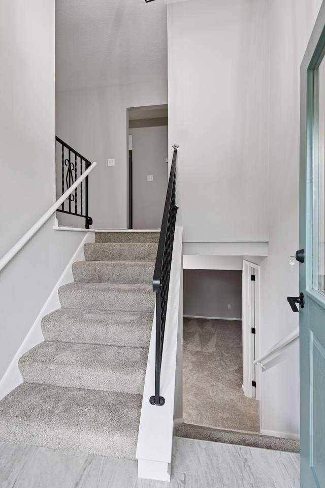 711 9th St NW, Buffalo, MN 55313 - staircase with carpet floors