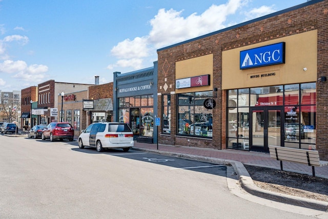 711 9th St NW, Buffalo, MN 55313 - view of commercial property with uncovered parking
