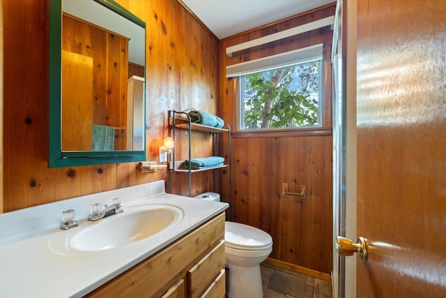 2236 Birch Point Rd Unit A, Tower, MN 55790 - bathroom with wood walls, vanity, and stone finish floors