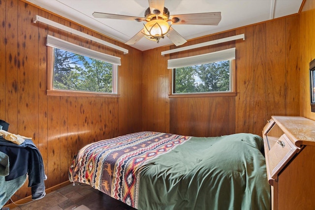 2236 Birch Point Rd Unit A, Tower, MN 55790 - bedroom with multiple windows, wooden walls, and ceiling fan