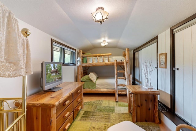 2236 Birch Point Rd Unit A, Tower, MN 55790 - bedroom with wood finished floors and lofted ceiling