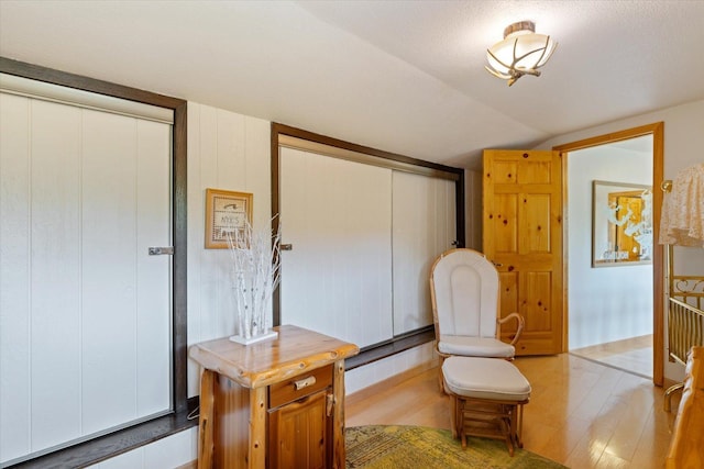 2236 Birch Point Rd Unit A, Tower, MN 55790 - sitting room with vaulted ceiling and wood finished floors