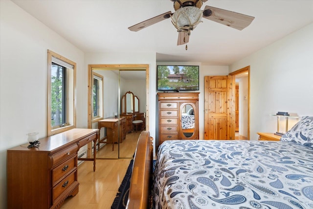 2236 Birch Point Rd Unit A, Tower, MN 55790 - bedroom featuring light wood finished floors, a closet, and a ceiling fan