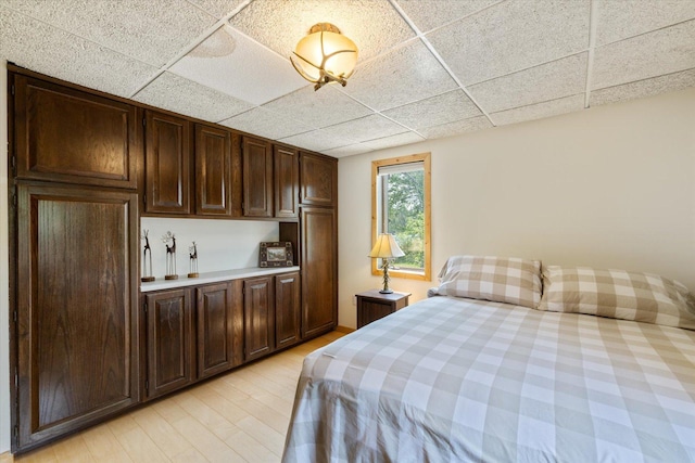 2236 Birch Point Rd Unit A, Tower, MN 55790 - bedroom featuring light wood-type flooring and a drop ceiling