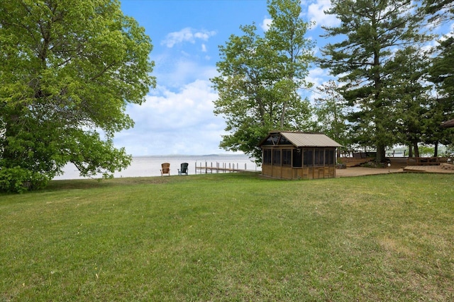 2236 Birch Point Rd Unit A, Tower, MN 55790 - view of grassy yard with a water view and a sunroom