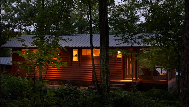 W160655 Hogback Rd Unit 5, Rusk Twp, WI 54728 - back of property featuring a metal roof and a deck