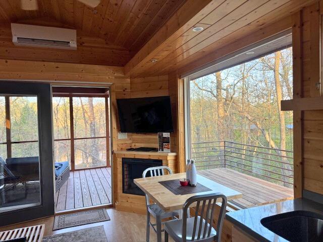 W160655 Hogback Rd Unit 5, Rusk Twp, WI 54728 - sunroom / solarium featuring an AC wall unit