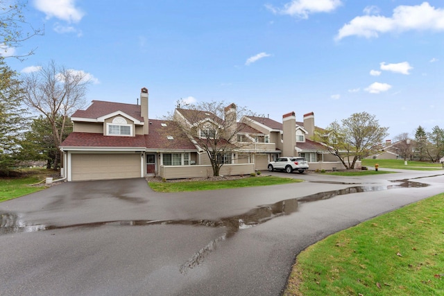 2060 Shenandoah Ct Unit F, Plymouth, MN 55447 - view of front facade featuring driveway, a residential view, a garage, and roof with shingles