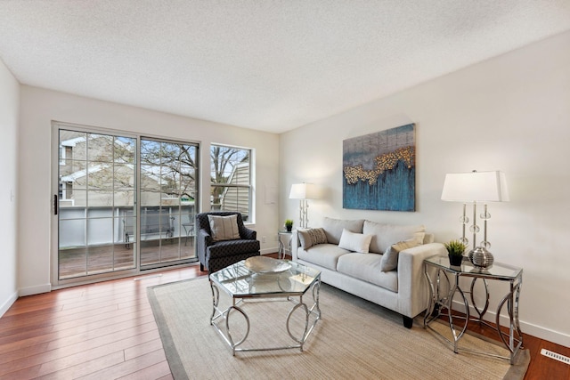 2060 Shenandoah Ct Unit F, Plymouth, MN 55447 - living area with wood finished floors and a textured ceiling