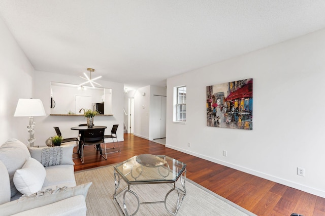 2060 Shenandoah Ct Unit F, Plymouth, MN 55447 - living room featuring baseboards and wood finished floors