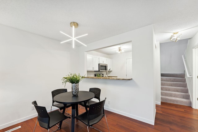 2060 Shenandoah Ct Unit F, Plymouth, MN 55447 - dining space with stairway and dark wood finished floors