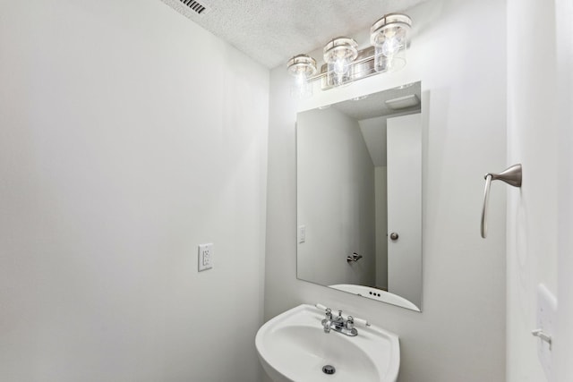 2060 Shenandoah Ct Unit F, Plymouth, MN 55447 - bathroom with a sink and a textured ceiling