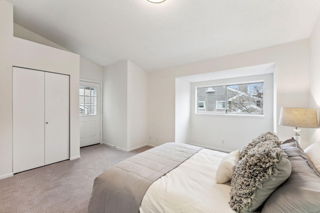 2060 Shenandoah Ct Unit F, Plymouth, MN 55447 - bedroom featuring carpet floors, vaulted ceiling, and a closet