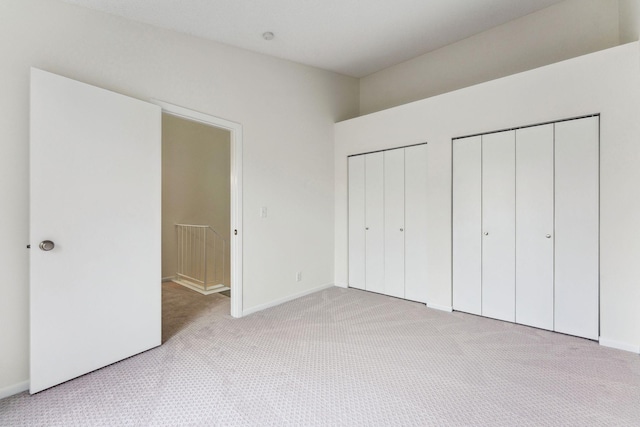 2060 Shenandoah Ct Unit F, Plymouth, MN 55447 - unfurnished bedroom with light colored carpet and two closets