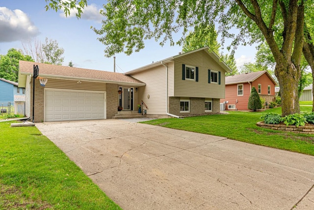 2115 3rd Ave NE, Owatonna, MN 55060 - tri-level home with a garage, brick siding, a front yard, and concrete driveway
