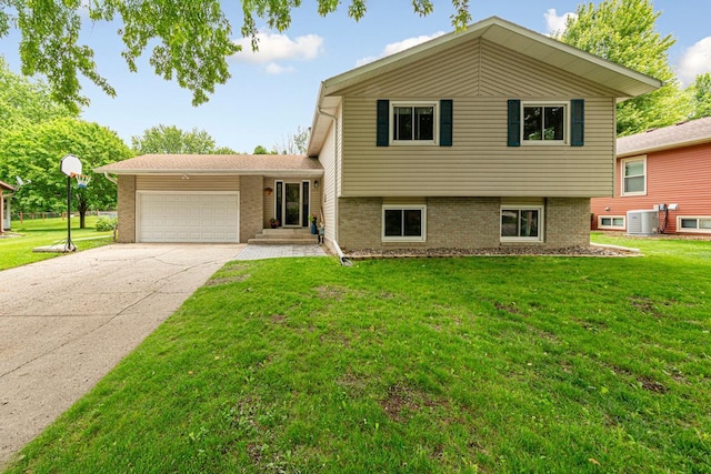2115 3rd Ave NE, Owatonna, MN 55060 - split level home featuring a garage, a front lawn, and brick siding