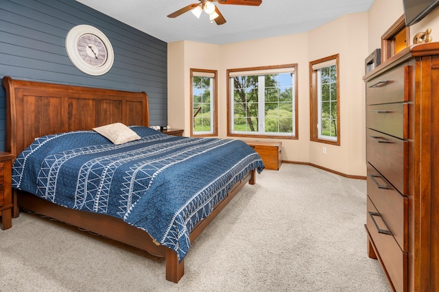 1805 Maple Ln, Saint Cloud, MN 56304 - bedroom featuring carpet, wooden walls, and ceiling fan