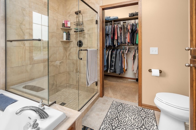 1805 Maple Ln, Saint Cloud, MN 56304 - full bathroom featuring a shower stall, a bath, tile patterned flooring, and a spacious closet