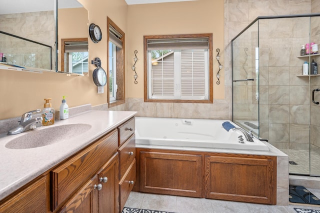 1805 Maple Ln, Saint Cloud, MN 56304 - full bath with vanity, a shower stall, a jetted tub, and plenty of natural light