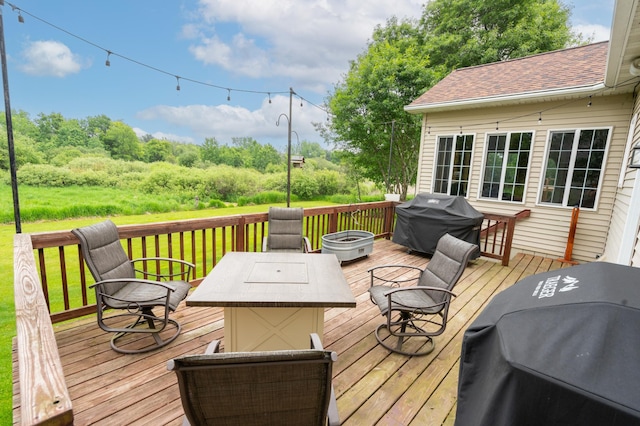 1805 Maple Ln, Saint Cloud, MN 56304 - wooden terrace with a grill and a fire pit
