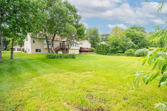 1805 Maple Ln, Saint Cloud, MN 56304 - view of green lawn featuring a wooden deck and stairs