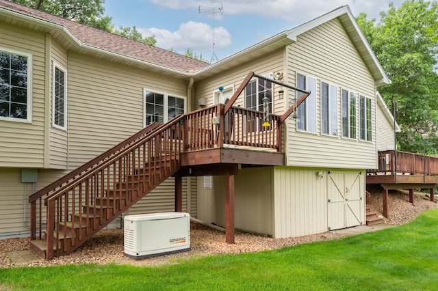 1805 Maple Ln, Saint Cloud, MN 56304 - back of property featuring a deck, a lawn, stairway, and roof with shingles