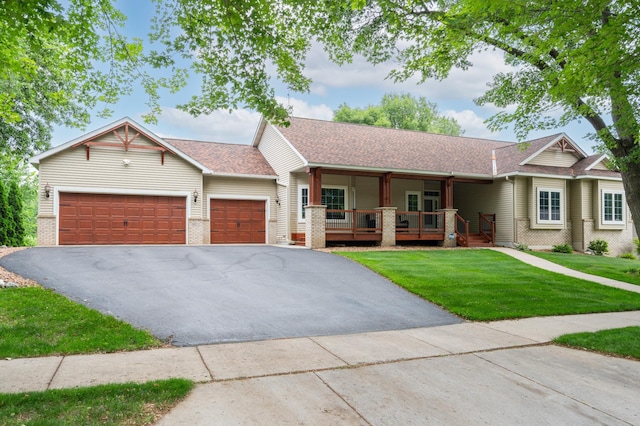 1805 Maple Ln, Saint Cloud, MN 56304 - single story home featuring an attached garage, a front yard, asphalt driveway, a porch, and a shingled roof