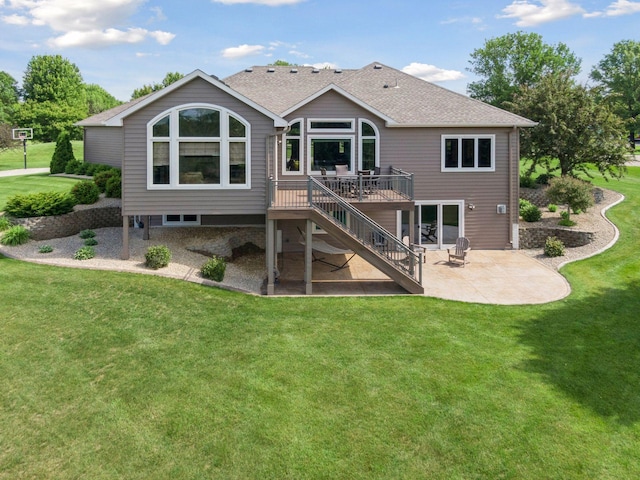 9015 Schutte Ct, Corcoran, MN 55340 - back of property featuring a patio area, a deck, stairs, and a yard