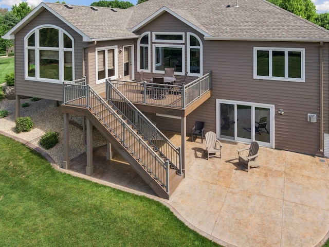 9015 Schutte Ct, Corcoran, MN 55340 - back of house featuring stairway, roof with shingles, and a patio