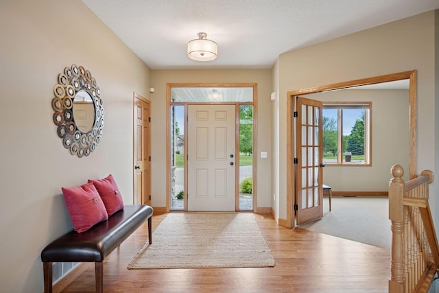 9015 Schutte Ct, Corcoran, MN 55340 - foyer featuring light wood finished floors and baseboards