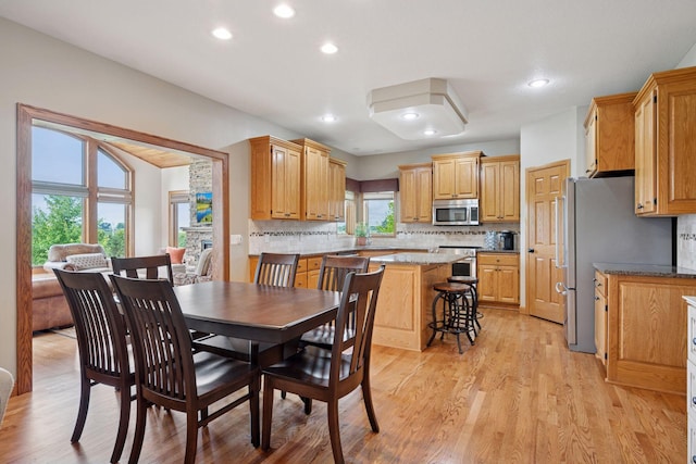 9015 Schutte Ct, Corcoran, MN 55340 - dining room with recessed lighting and light wood-style flooring