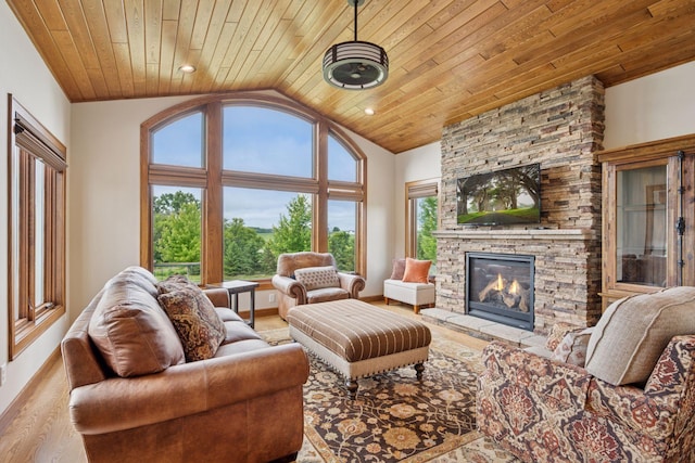 9015 Schutte Ct, Corcoran, MN 55340 - living area featuring a stone fireplace, wood ceiling, wood finished floors, and vaulted ceiling