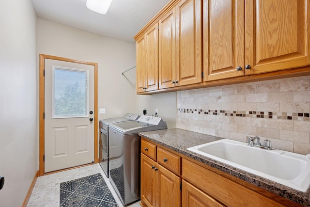 9015 Schutte Ct, Corcoran, MN 55340 - laundry area featuring washer and clothes dryer and cabinet space