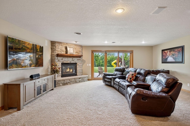 9015 Schutte Ct, Corcoran, MN 55340 - living area with carpet floors, a stone fireplace, a textured ceiling, and recessed lighting