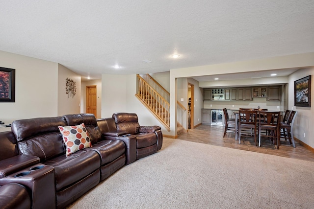 9015 Schutte Ct, Corcoran, MN 55340 - living room with light colored carpet, stairway, recessed lighting, bar, and a textured ceiling