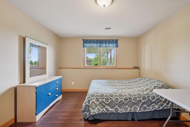 9015 Schutte Ct, Corcoran, MN 55340 - bedroom featuring baseboards and dark wood-style flooring