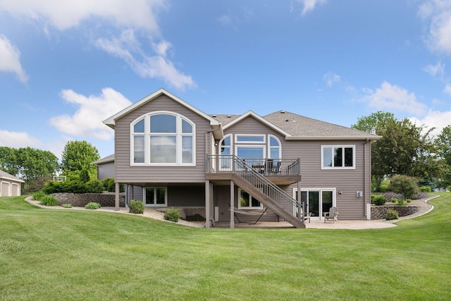 9015 Schutte Ct, Corcoran, MN 55340 - back of house with a patio, stairway, a wooden deck, a lawn, and roof with shingles