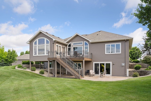 9015 Schutte Ct, Corcoran, MN 55340 - rear view of house featuring stairway, a deck, a patio, and a lawn