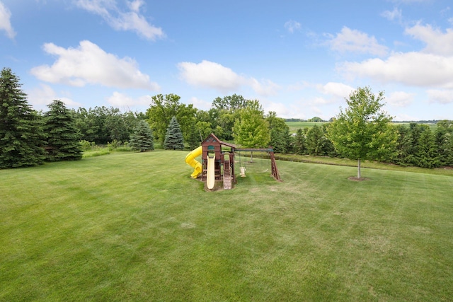 9015 Schutte Ct, Corcoran, MN 55340 - view of grassy yard featuring a playground